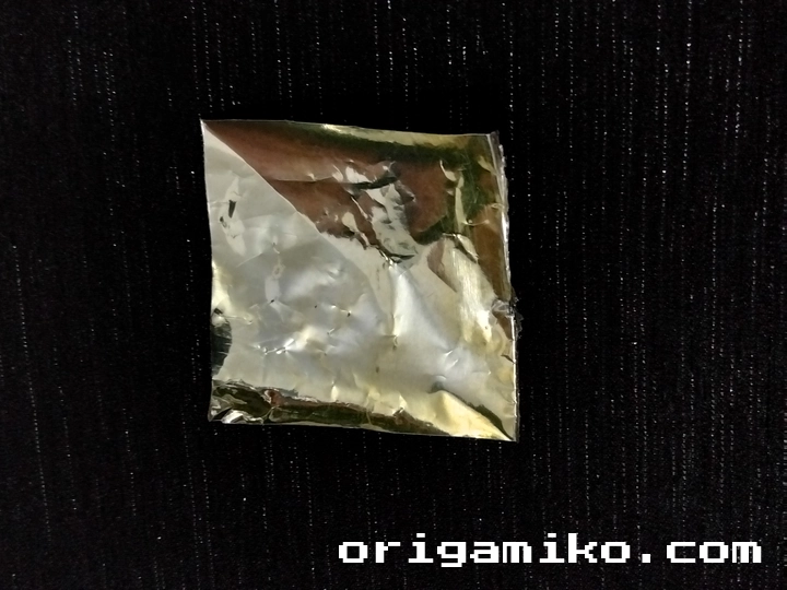 Gum wrapper origami crane step 1